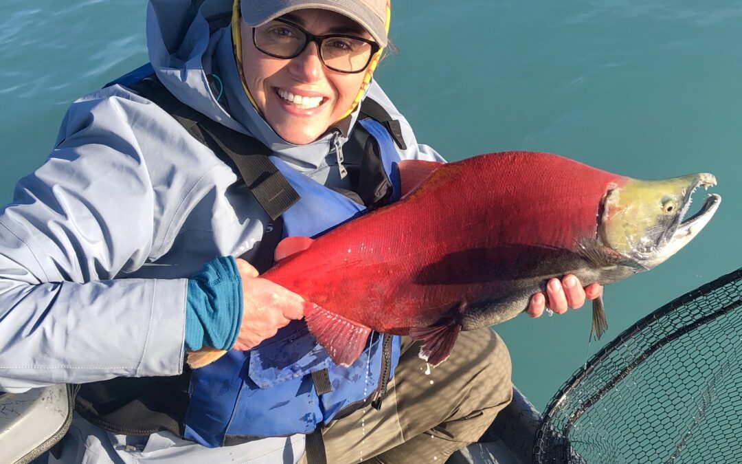 Woman holding red salmon